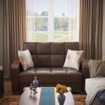 brown leather love seat